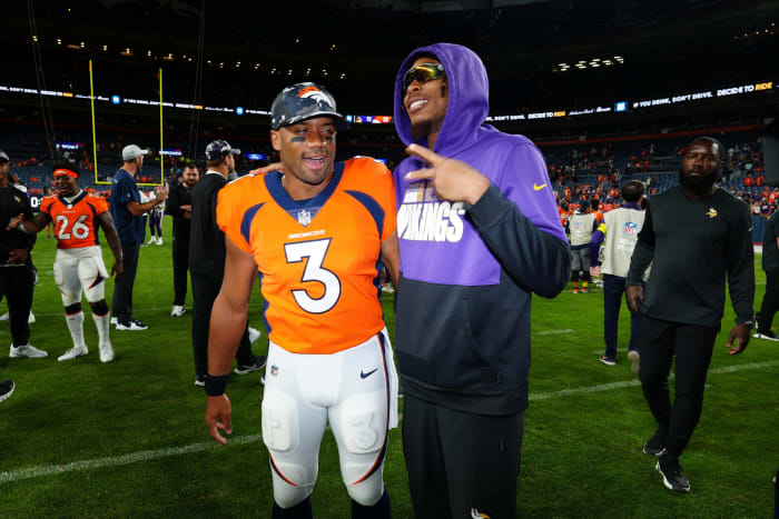 Aug 27, 2022; Denver, Colorado, USA; Denver Broncos quarterback Russell Wilson (3) and Minnesota Vikings wide receiver Justin Jefferson (18) meet following a preseason game at Empower Field at Mile High.